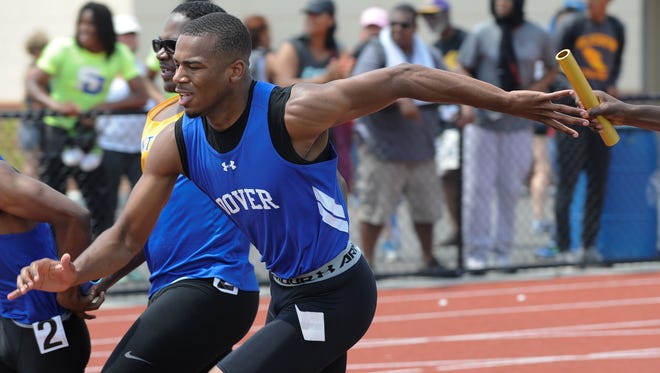 Dover's Kevin Brown receives the baton in the 4x100 meter relay at the state track meet at Dover High School.