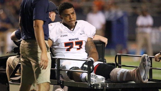 UTEP offensive lineman Greg Long is led off the field after suffering an injury in September 2017 against Rice in Sun Bowl Stadium. He ended up being out for the season. Several UTEP players were helped off the field during the game.