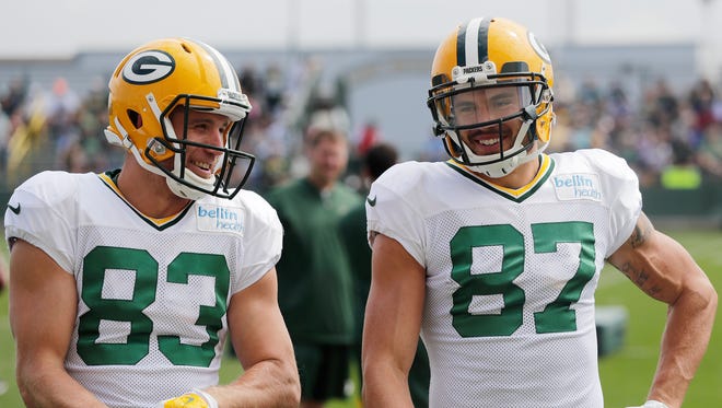 Green Bay Packers wide receiver Jordy Nelson (left) and wide receiver Jeff Janis joke with each other while wearing each wearing the other's jerseys during training camp practice on Tuesday, August 29, 2017, at Ray Nitschke Field.