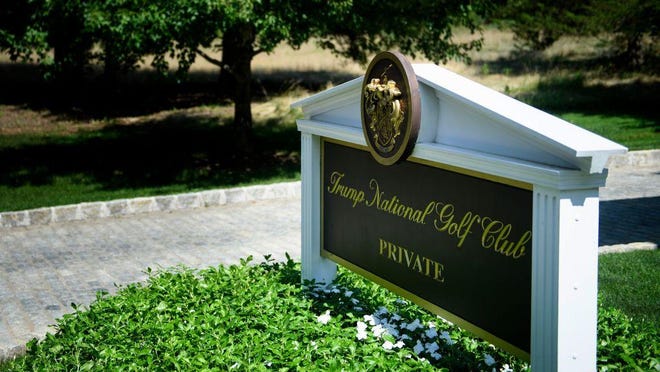 A sign is seen at an entrance to the Trump National Golf Club August 9, 2018 in Bedminster, New Jersey. A lawyer for a dozen workers at the club who are in the United States illegally says they were fired this month even though managers knew of their illegal status years ago.