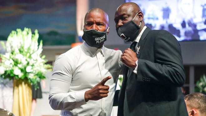 Civil rights attorney Ben Crump poses for a picture with actor Jamie Foxx after the funeral for George Floyd on June 9, at The Fountain of Praise church in Houston. Floyd died after being restrained by Minneapolis Police officers on May 25.