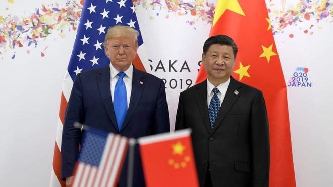 President Donald Trump poses for a photo with Chinese President Xi Jinping during a meeting on the sidelines of the G-20 summit in Osaka, Japan, on June 29, 2019. Susan Walsh, AP.