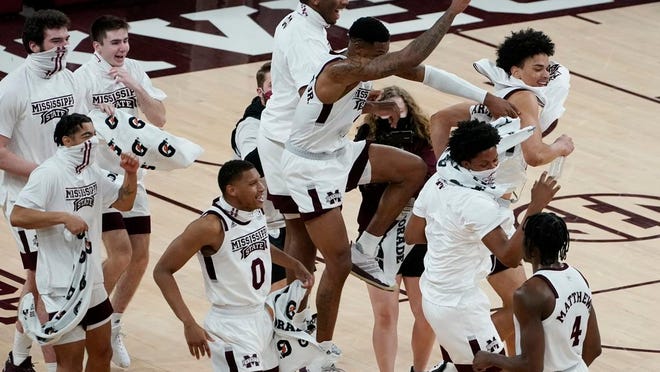 Mississippi State players celebrate a 78-63 win over Missouri in an NCAA college basketball game Tuesday, Jan. 5, 2021, in Starkville, Miss.