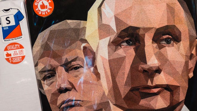 A picture taken on June 27, 2017 shows a T-shirt featuring the President Trump and Russian President Vladimir Putin with a sign "We Love Russia" on sale at a souvenir shop in Saint Petersburg.