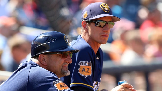 Manager Craig Counsell (right) says roster changes help put the best team on the field.