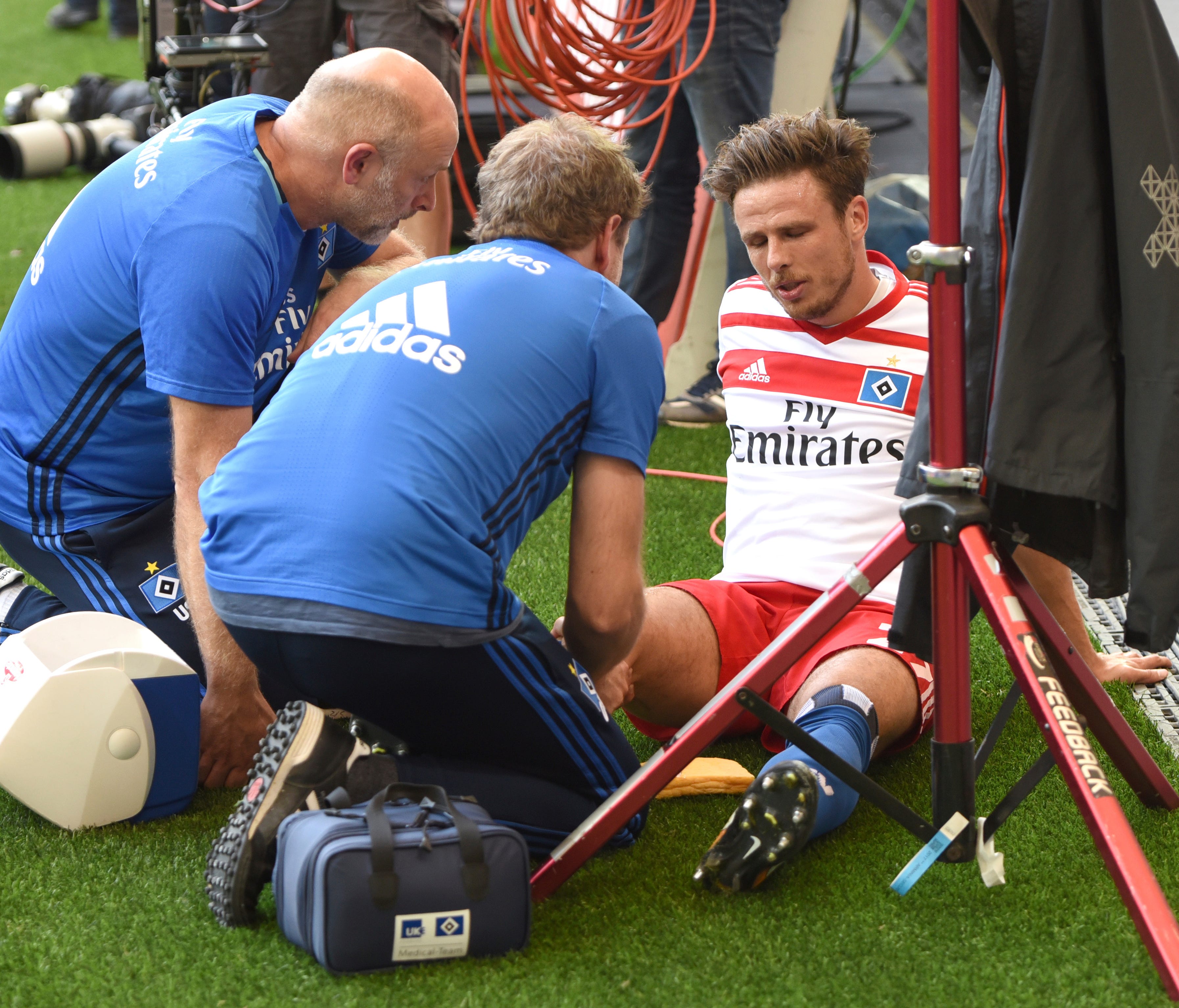 Hamburg's Nicolai Mueller is treated during the German Bundesliga match after being injured during a celebration.
