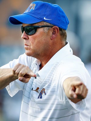 University of Memphis Offensive Coordinator & Running Backs coach Darrell Dickey during warm up before taking on Southern Illinois University  at the Liberty Bowl Memorial Stadium Saturday, September 23, 2017.