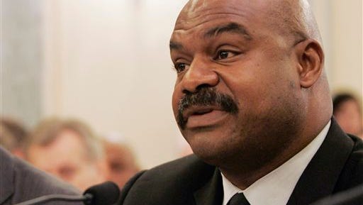 FILE - In this Sept. 18, 2007 file photo, former Chicago Bears safety Dave Duerson, a trustee for the Burt Bell/Pete Rozell NFL Player Retirement Plan, testifies on Capitol Hill in Washington. Tuesday remains the deadline to opt out of the NFL's class-action settlement of concussion claims after a judge denied requests by former players for an extension. Lawyers for Duerson's family and others had asked for a delay until after objections are weighed at a Nov. 19 fairness hearing. Duerson committed suicide on Feb. 17, 2011. (AP Photo/Susan Walsh, File)