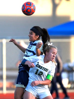 Yuma Catholic's Cazzia Padilla (15) battles Casteel's Samantha Anger (12) for the ball during the 3A girls soccer final at Williams Field High School in Gilbert on February 10, 2018. 