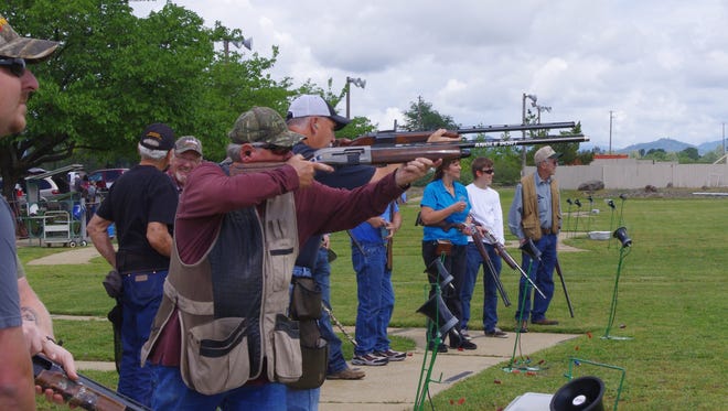 Members of the Associated California Loggers Redding Chapter participate in a trap shooting competition at the Redding Gun Club on Sunday to raise money for ill children.