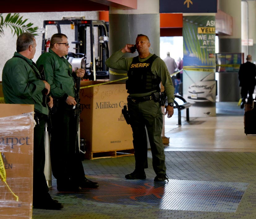 Broward Sheriffs' Deputies stand guard outside the entrance to the Terminal 2 baggage area at Fort Lauderdale-Hollywood International Airport on Jan. 8, 2017, after a gunman opened fire two days earlier in a baggage claim area at the Fort Lauderdale-