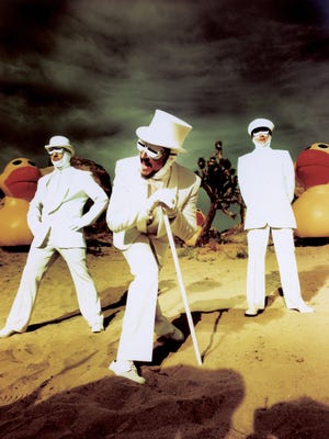 
 Primus is fronted by Les Claypool (center).
