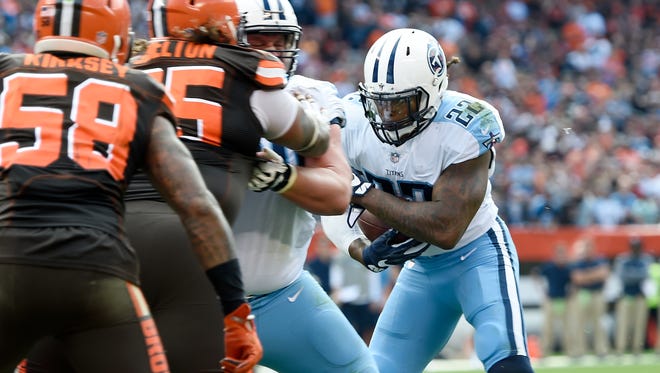 Titans running back Derrick Henry (22) is stopped at the 1-yard line on a fourth-down play during the third quarter Oct. 22 at FirstEnergy Stadium.
