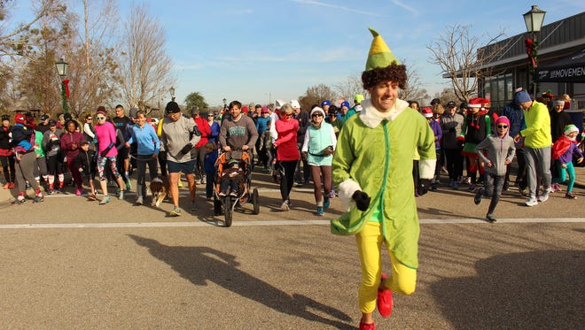 Avery Ainsworth wears his lucky “Elf” costume ahead of the field to start Saturday’s “Elf” Fun Run at Hampstead. Alvin Benn/Special to the Advertiser