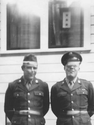 Brothers Everett Bowder, left, and Clifford Bowder, who both served in the Army during World War II, in front of their parents' home in Salem. Notice the service flag with three stars in the window. Their brother, Grant Bowder, also served in the Navy during the war.
