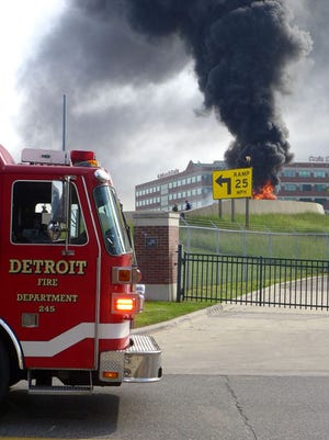 Detroit fireman respond to an explosion and tanker fire on northbound I-75 in Detroit, Sunday, May 24, 2015.  The driver of the taker was able to escape the explosion with no injuries.