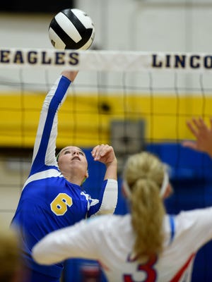 Lincoln's Laynie Russell hits against Union County's Madison Rosenberger Thursday, Sept. 8, 2016, during a volleyball game in Cambridge City.
