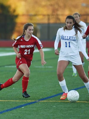 Red Hook's Lauren Engel, left, rushes the ball as Wallkill's Ashlan Hubbard, right, looks for an open teammate during the MHAL semifinal game at Franklin D. Roosevelt High School. 