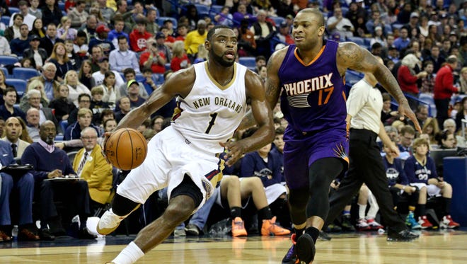 New Orleans Pelicans forward Tyreke Evans (1) drives past Phoenix Suns forward P.J. Tucker (17) during the first quarter of a game at Smoothie King Center in New Orleans on Dec. 30.