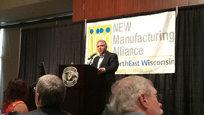 Lindquist Machine Corp. CEO Mark Kaiser speaks to more than 300 people who attended the Northeast Wisconsin Manufacturing Alliance's 10th anniversary lunch.