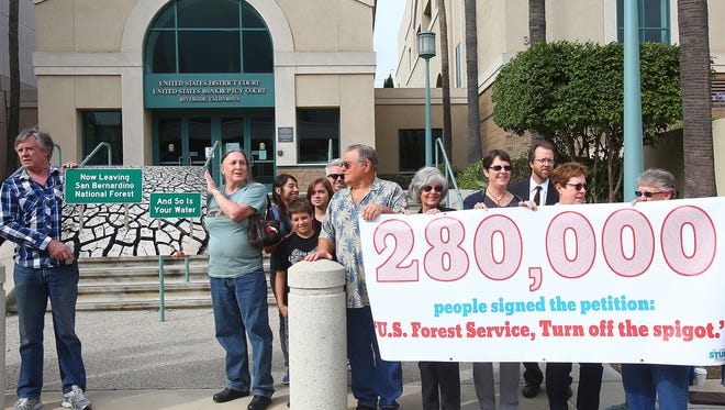 A group opposed to Nestle's extraction of water from the San Bernardino National Forest holds a rally before a court hearing at the U.S. District Court in Riverside on June 13, 2016.