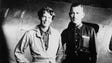 Amelia Earhart and her navigator, Fred Noonan, in front