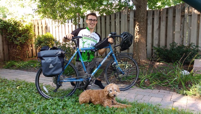 Ryan Hall, a 2011 Churchill High School graduate, is riding his bicycle across the country to bring awareness to climate change.