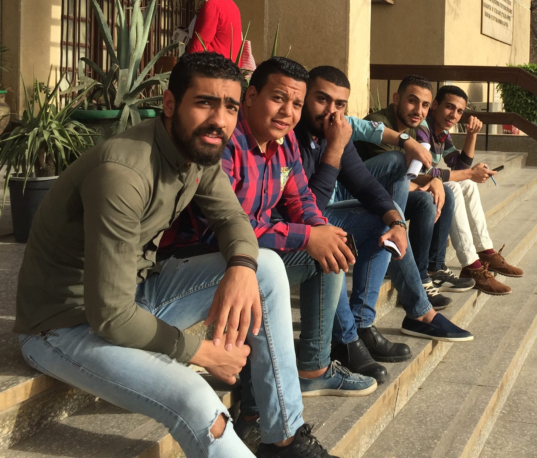 Cairo University undergraduates take a break outside the campus examination hall. All student and faculty political activities have been banned at Egypt's 43 public and private universities since the 2013 ascension of Abdel Fatah El-Sissi to power.