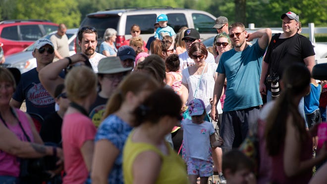 Visitors wait for the gates to open on opening day at Animal Adventure in Harpursville on Saturday.