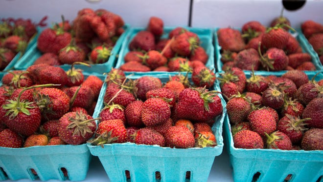 Strawberries from Mountain Top Greenhouses on sale during last year's Owego Strawberry Festival.