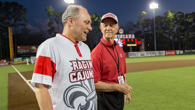 Gerald Hebert (right) walks with Steve Scalise at M.L. "Tigue" Moore Field on Feb. 23 for a Ragin' Cajuns game against Wright State. Hebert will be inducted to the Louisiana Athletics Hall of Fame on Friday as part of UL's Homecoming festivities.