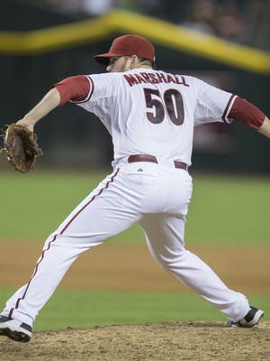 Diamondbacks' Evan Marshall pitches in relief against the Giants at Chase Field in Phoenix, AZ on Friday, June 20, 2014.