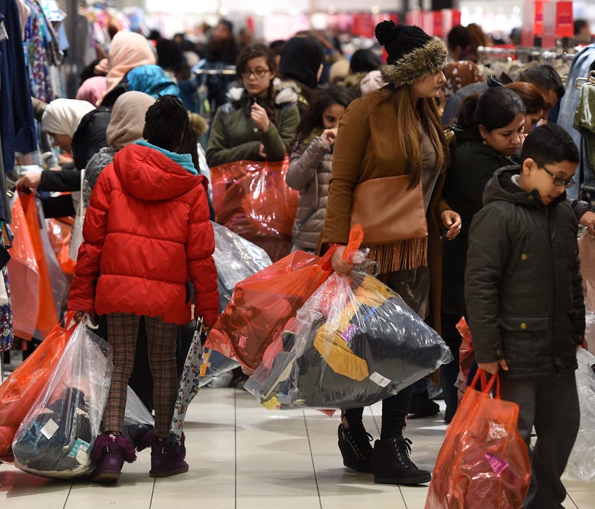 Shoppers crowd the shop floot at a Next department store during the Boxing Day sales at Highcross Shopping Center in Leicester England  on Dec. 26, 2016.