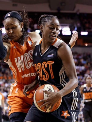 Western Conference's Maya Moore, left, of the Minnesota Lynx, tries to avoid running into Eastern Conference's Tiffany Hayes, of the Atlanta Dream, during the second half of the WNBA All-Star basketball game Saturday, July 22, 2017, in Seattle. The West won p130-121. (AP Photo/Elaine Thompson)