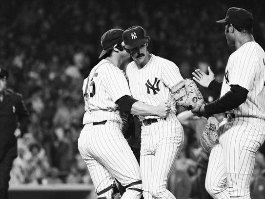 Yankees pitcher Ron Guidry, center, is congratulated