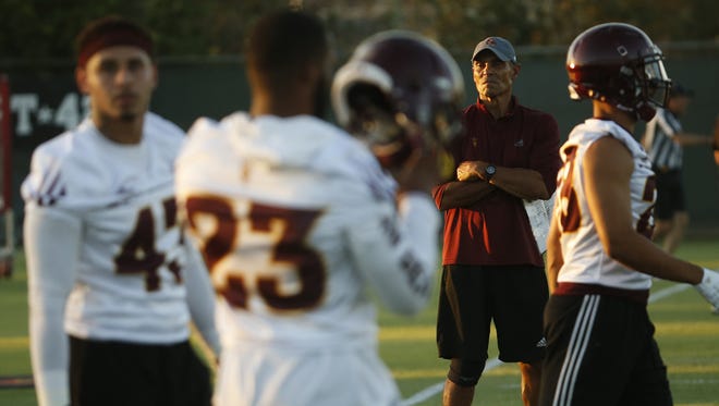 ASU head coach Herm Edwards watches his team during practice at Kajikawa Practice Fields in Tempe, Ariz. on Aug. 3, 2018.