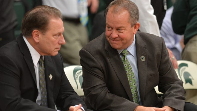 MSU athletic director Mark Hollis, right, and Tom Izzo both received one-year contract extensions on Wednesday.