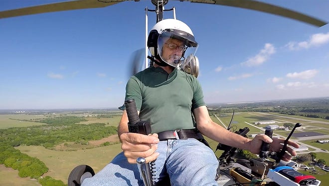In this March, 2015, photo, Doug Hughes flies his gyrocopter near the Wauchula Municipal Airport in Wauchula, Fla. Police didn't immediately identify the man who steered his one-person helicopter onto the West Lawn of the U.S. Capitol, but Hughes, a Florida postal carrier, took responsibility for the stunt on a website. (James Borchuck/The Tampa Bay Times via AP)