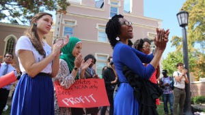 Students cheer at "Speaking Back to the Wainstein Report" at the South Building at UNC.