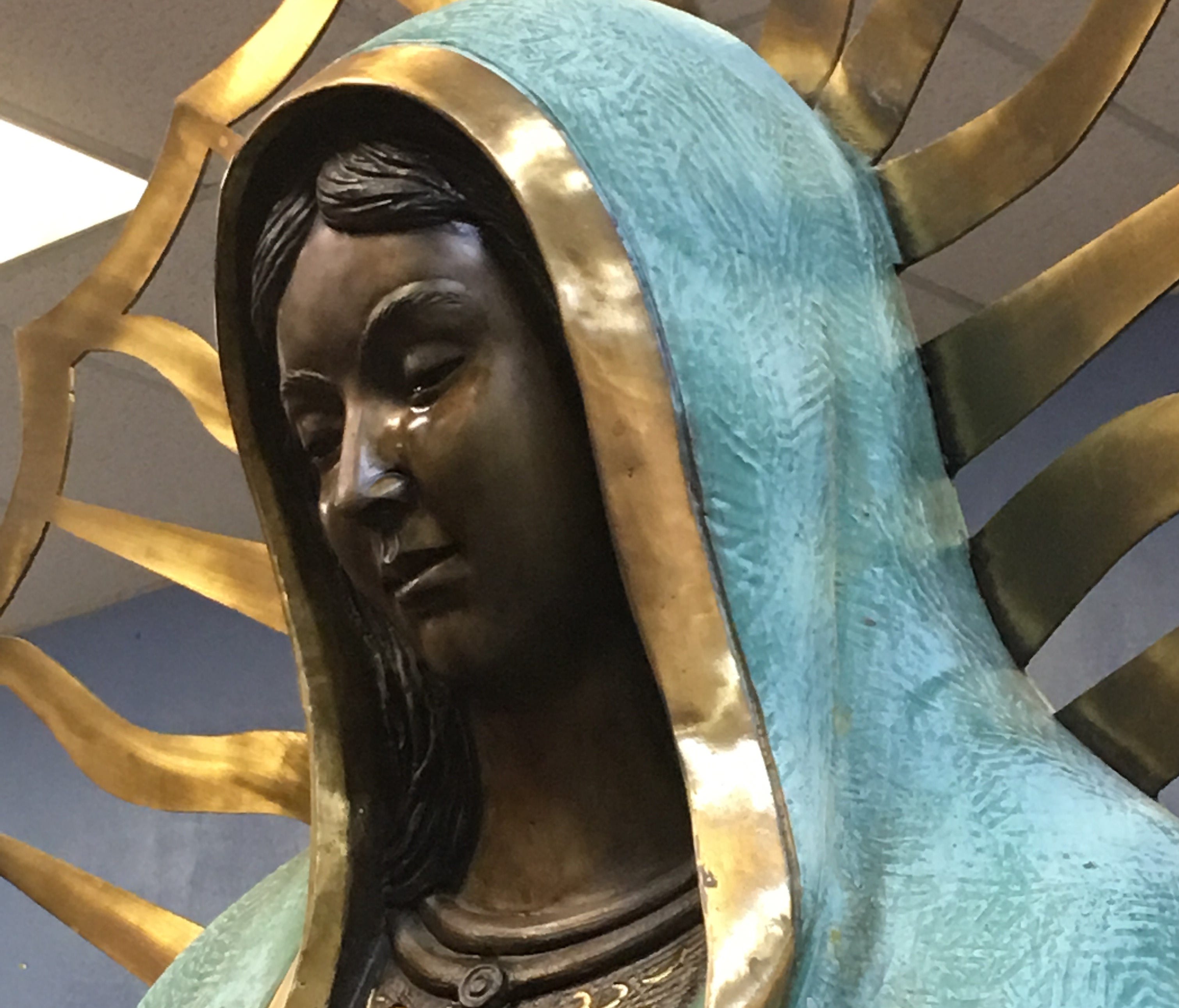 The statue of the Virgin Mary inside Our Lady of Guadalupe Church Sunday shows signs of weeping from her eyes. Parishioners witnessed the statue crying during the church's noon mass.
