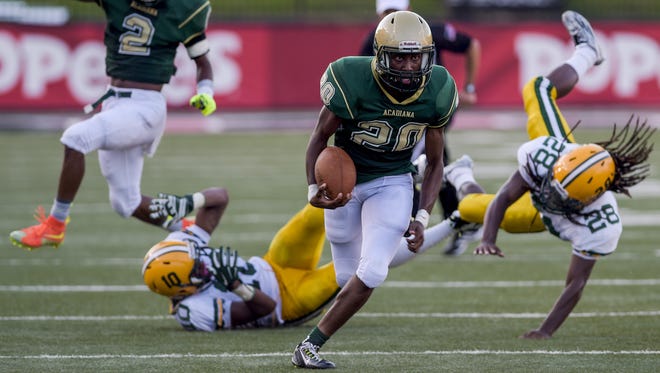 Acadiana quarterback Myles Hutchinson (20) sprints for a large gain during the second half of the Kiwanis Gridiron Jamboree against Cecilia at Cajun Field in Lafayette, LA, Friday, Aug. 28, 2015.