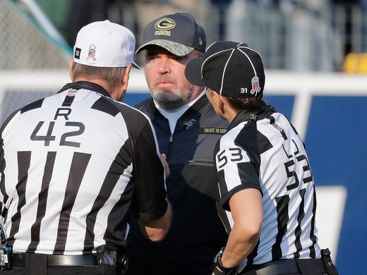 Green Bay Packers head coach Mike McCarthy talks to