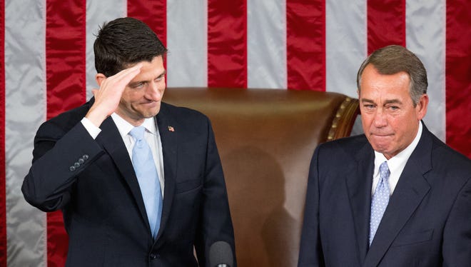 House Speaker John Boehner stands with his successor Rep. Paul Ryan, R-Wis., left, in the House Chamber on Capitol Hill in Washington, Thursday, Oct. 29, 2015. Republicans rallied behind Ryan to elect him the House's 54th speaker on Thursday as a splintered GOP turned to the youthful but battle-tested lawmaker to mend its self-inflicted wounds and craft a conservative message to woo voters in next year's elections. (AP Photo/Andrew Harnik)