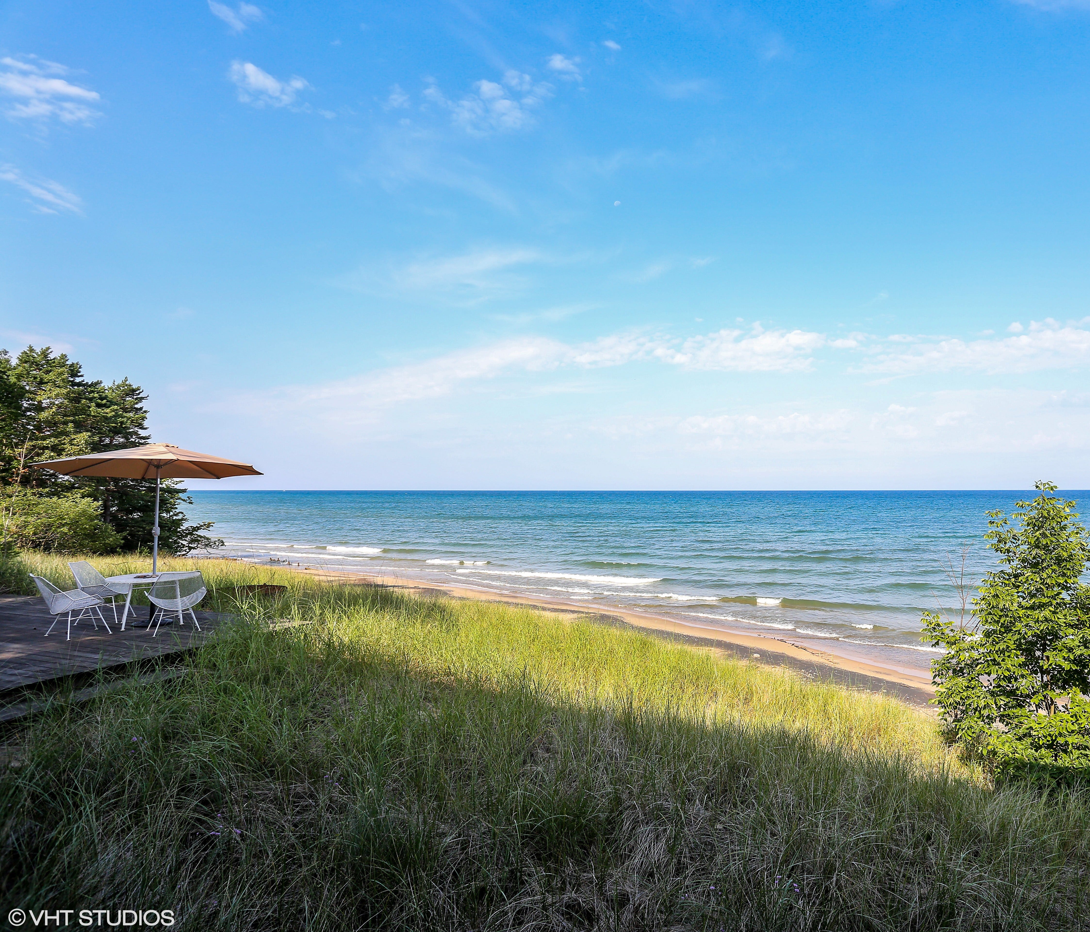 The Blue Star Highway home on Lake Michigan has a detached Coach House with kitchenette,full bath and private deck. The property also has a Hot Tub Pavilion.