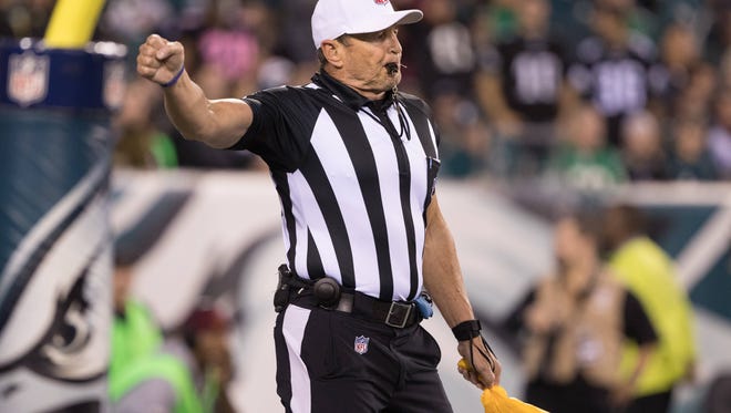 Referee Ed Hochuli (85) is retiring from the NFL.