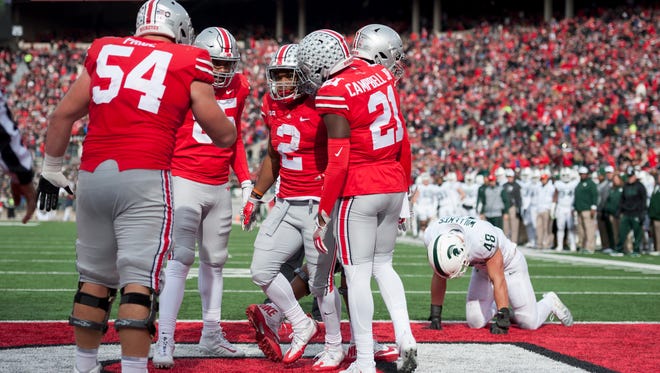 Ohio State celebrates an 8-yard touchdown pass catch by running back J.K. Dobbins in the second quarter.