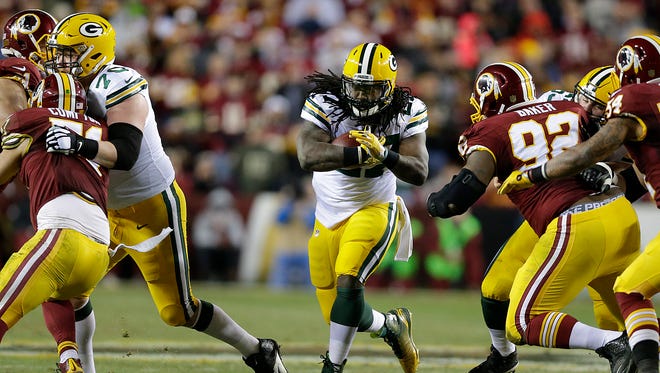 Green Bay Packers running back Eddie Lacy (27) runs through an opening against Washington Redskins during their NFC wild-card round playoff game at FedEx Field.