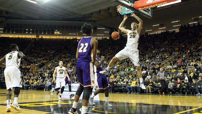 Iowa's Jarrod Uthoff dunks the ball during the Hawkeyes' game against Western Illinois at Carver-Hawkeye Arena on Monday.