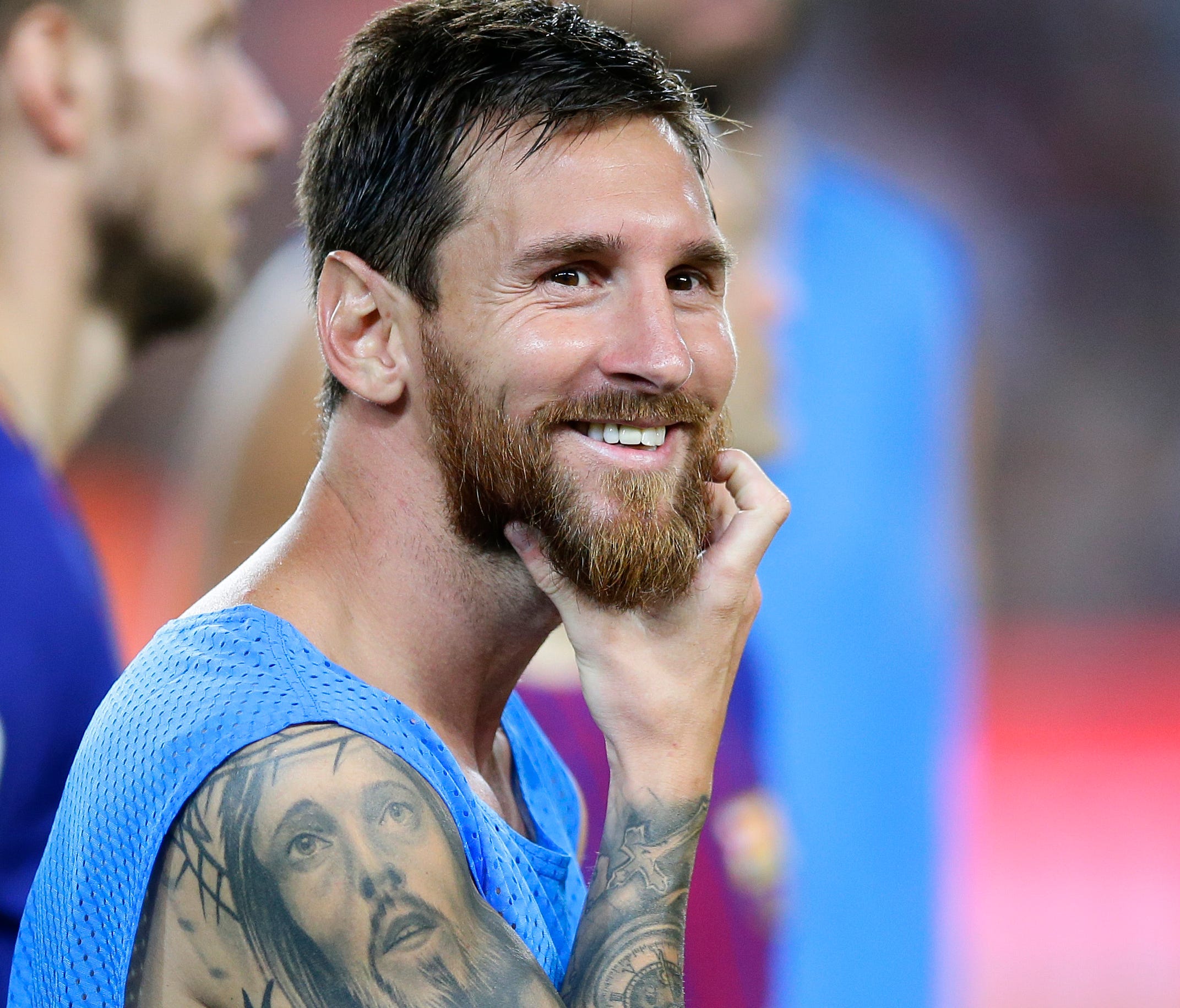 FC Barcelona's Lionel Messi smiles after the Joan Gamper trophy soccer match between FC Barcelona and Chapecoense at the Camp Nou stadium in Barcelona, Spain, Monday, Aug. 7, 2017.