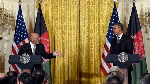 President Barack Obama listens as Afghanistan's President Ashraf Ghani speaks during their joint news conference in the East Room of the White House in Washington, Tuesday, March 24, 2015. Ghani represents Obama's last, best hope to make good on his promise to end America's longest war by the time he leaves office, keeping just a thousand or so troops at the embassy to coordinate security. (AP Photo/Susan Walsh)